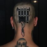 Prison escape head tattoo