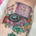 Colorful Beatles tattoo on girls leg