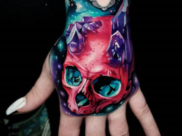 Pink skull & amethyst crystals hand tattoo
