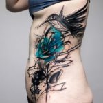 Sketchy bird & rose side tattoo