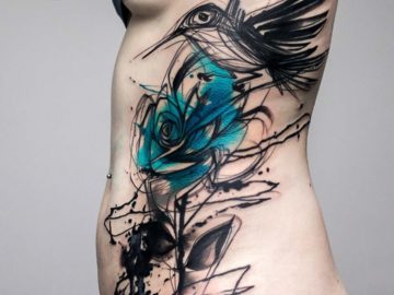 Sketchy bird & rose side tattoo