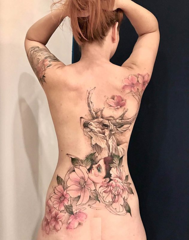 Watercolor deer & flowers back tattoo