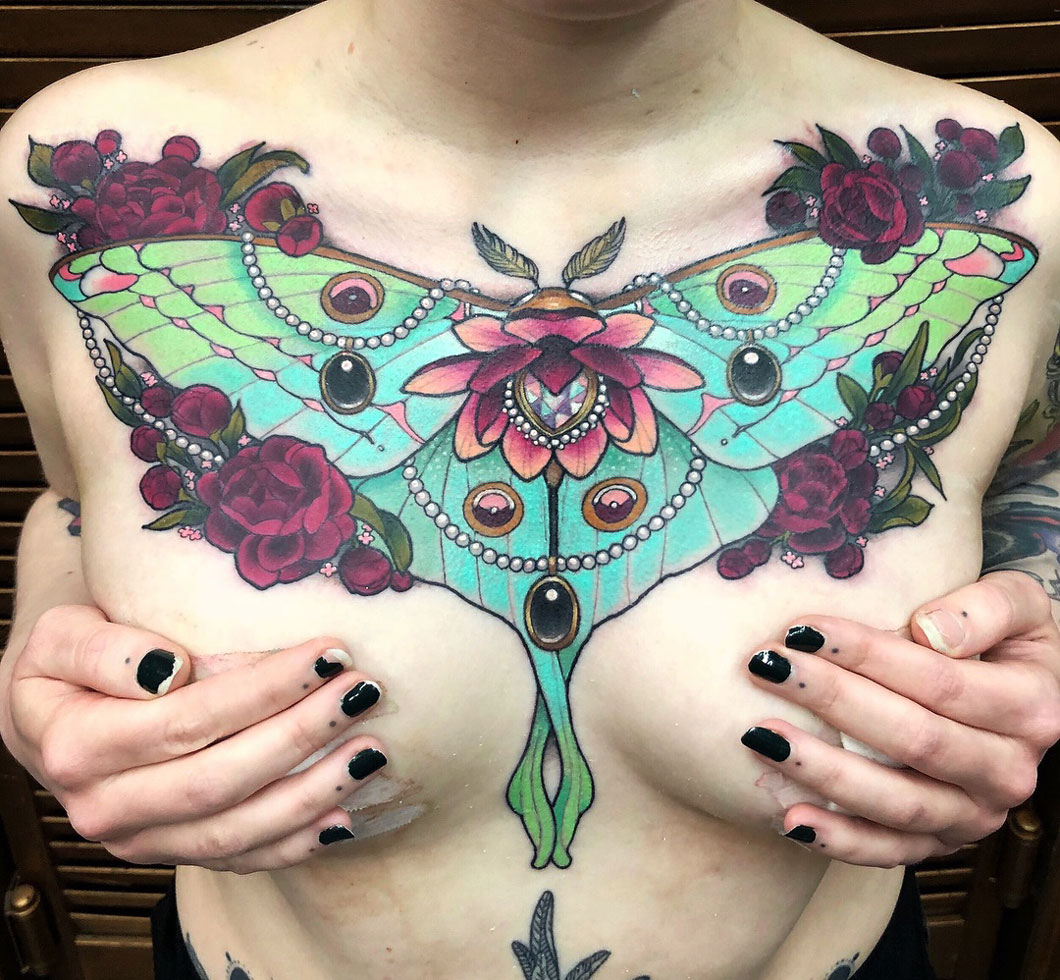 Pretty girl's chest piece, moth with flowers