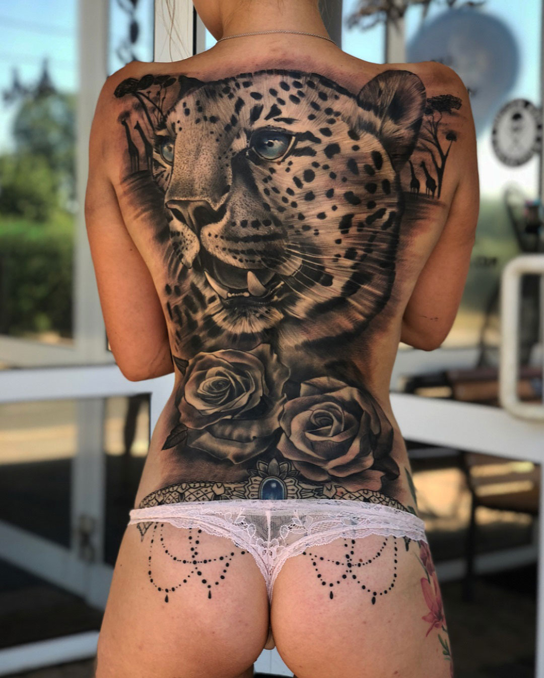 Leopard & roses full back tattoo