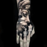 Hand tattoo with portrait