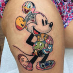 Disney characters thigh tattoo