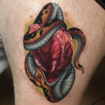 Snake & Heart thigh tattoo