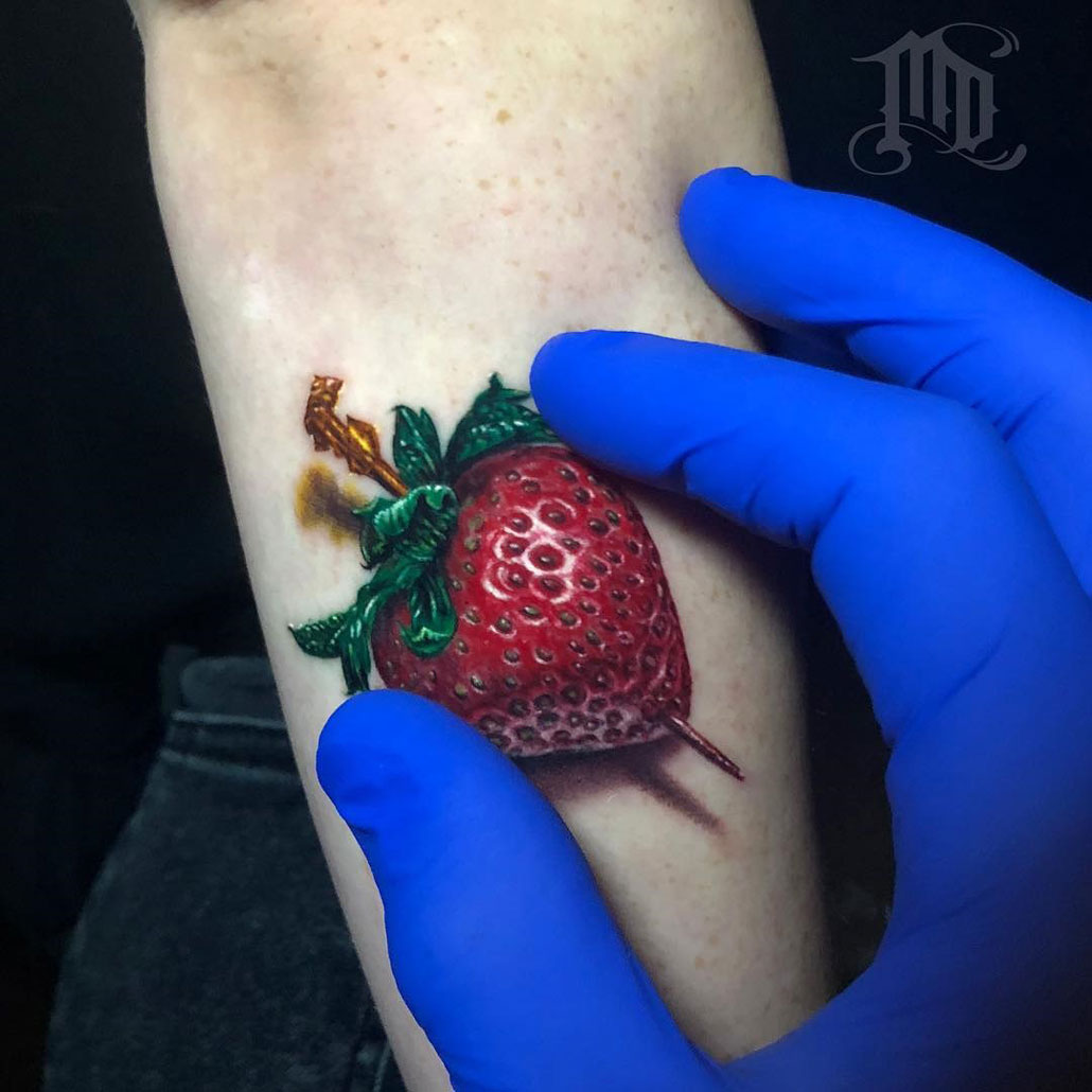 Strawberry arm tattoo