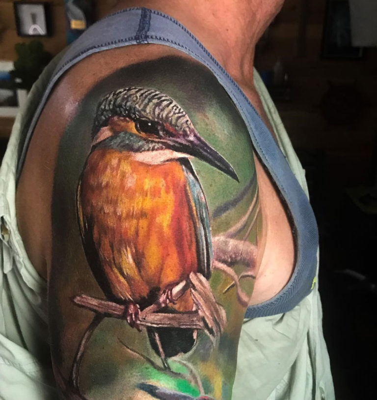 Realism piece with a Kingfisher perched on a branch with a desaturated  background, done on girls forearm b… | Realistic bird tattoo, Birds tattoo, Kingfisher  tattoo