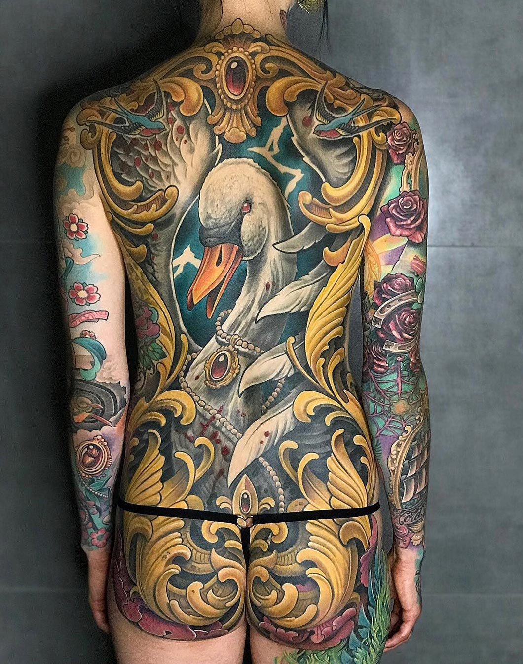 Swan & filigree back tattoo