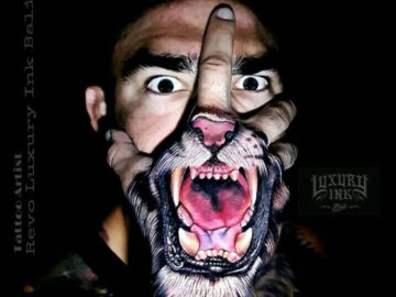 Tiger's mouth hand tattoo