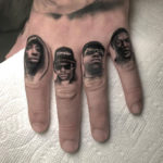 Rappers on guy's fingers