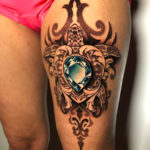 Ornamental turtle thigh tattoo