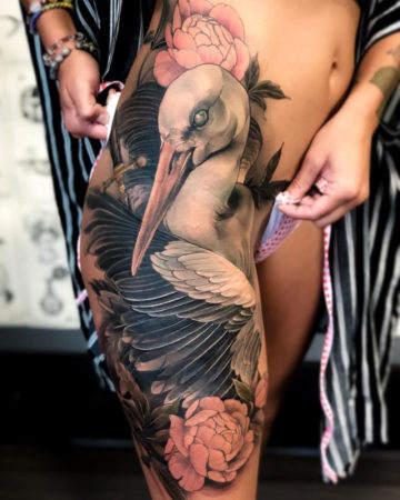 Stork & Peonies hip tattoo