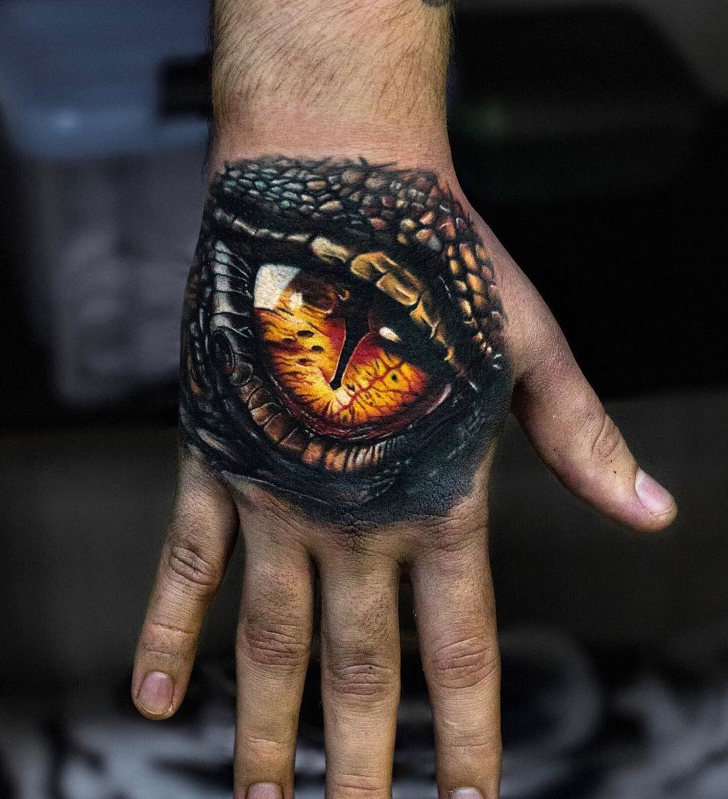 Dragon eye hand tattoo