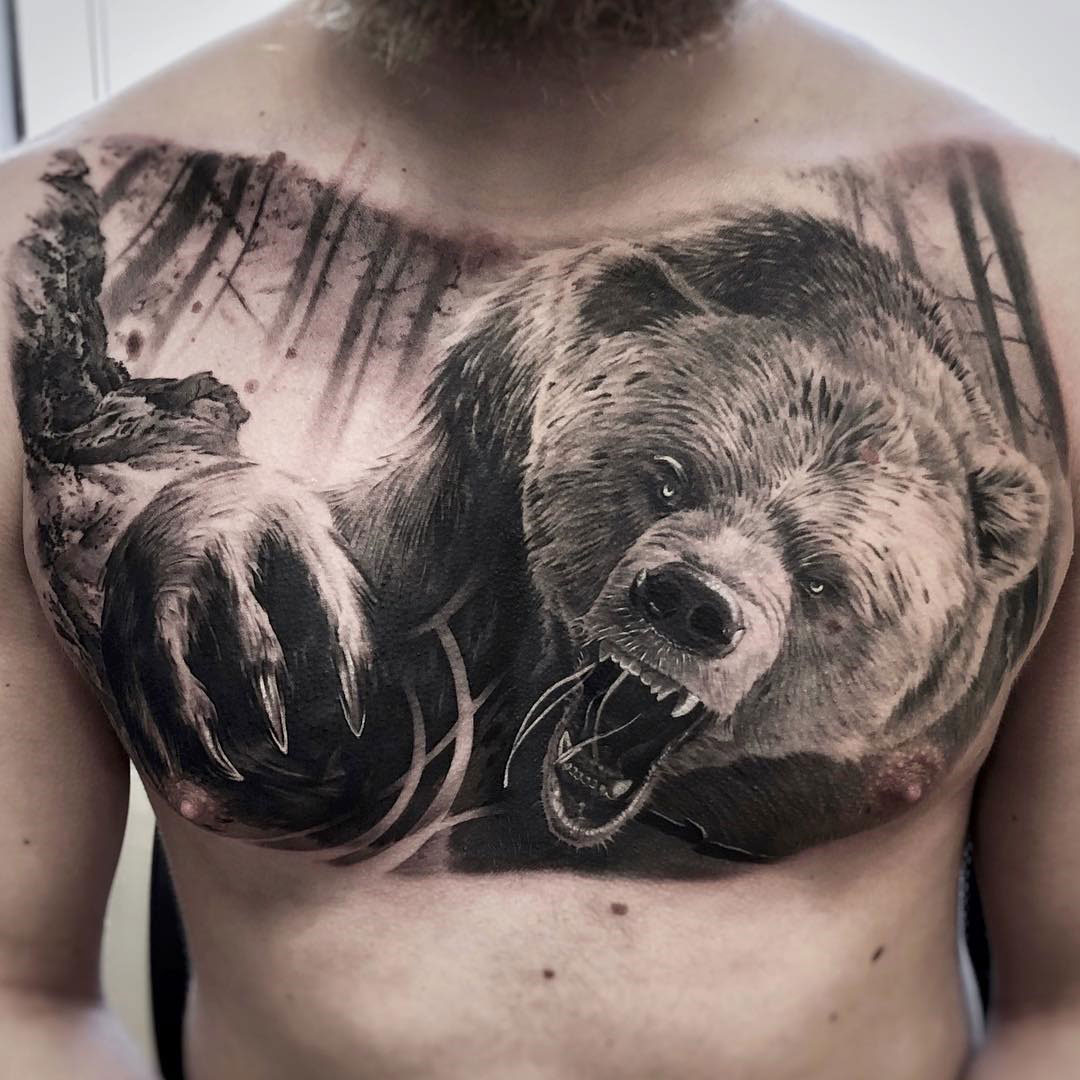 Realistic bear on guy's chest