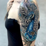Peacock realism, girl's upper arm