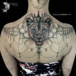 Lioness girl's back tattoo