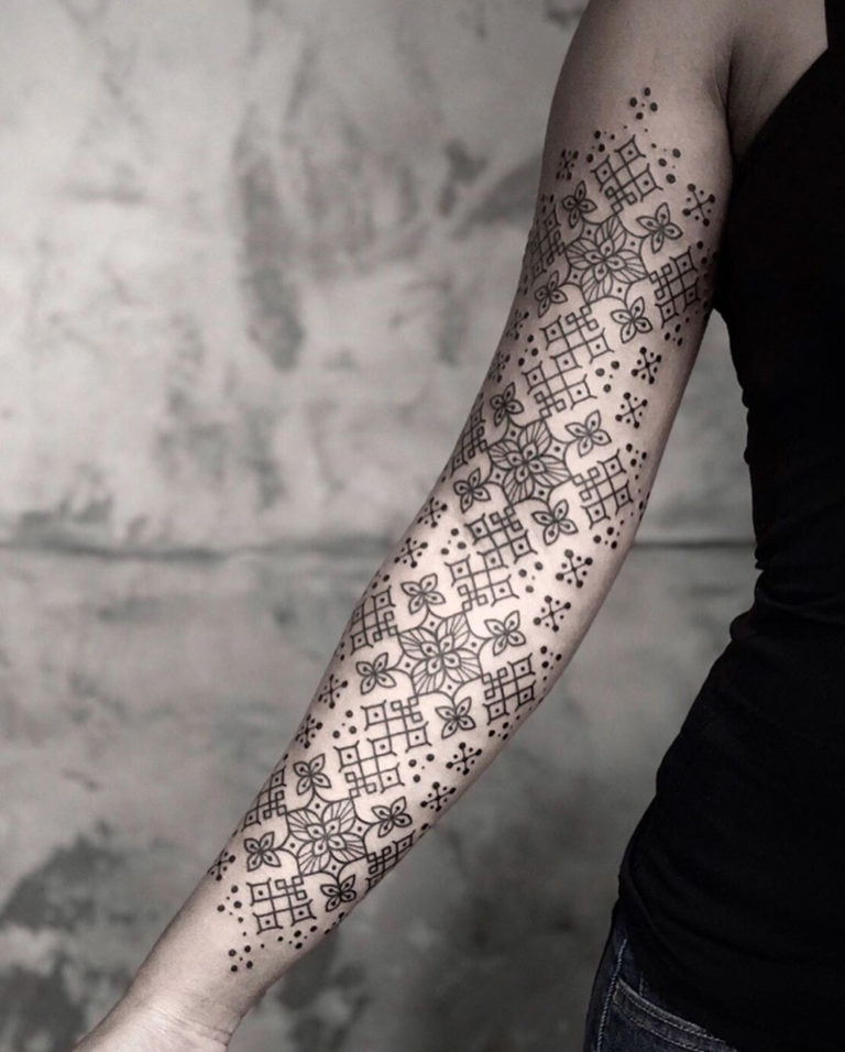 Dotwork floral arm tattoo