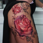 Pretty roses & pearls hip tattoo