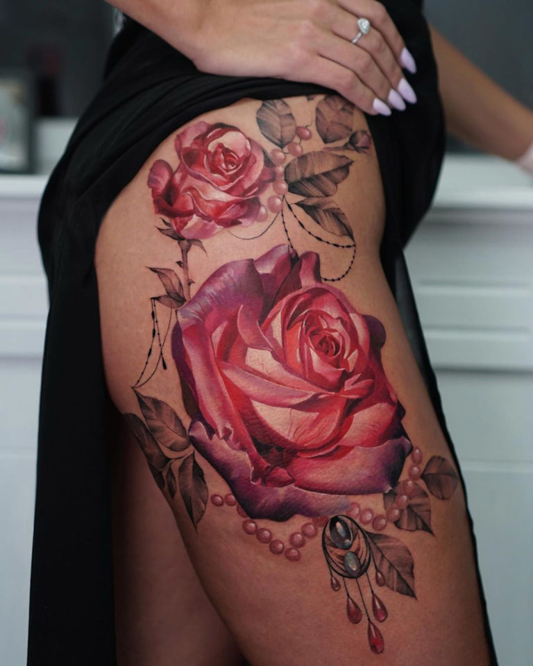 Pretty roses & pearls hip tattoo