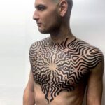 Men's chest pattern tattoo