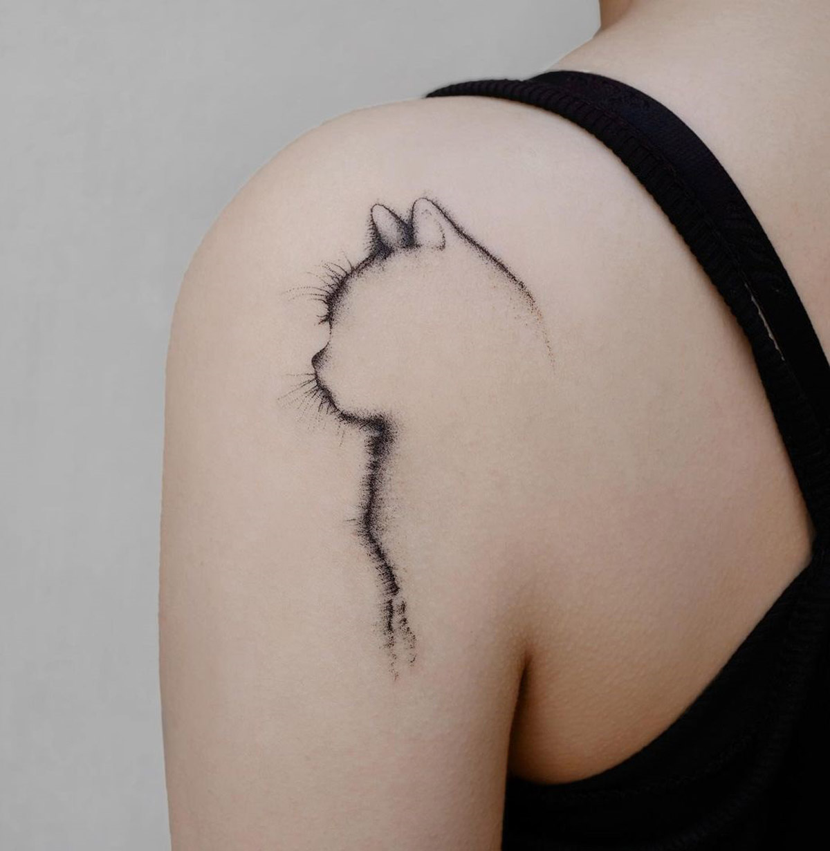 Abstract cat tattoo silhouette with floral accent Vector Image