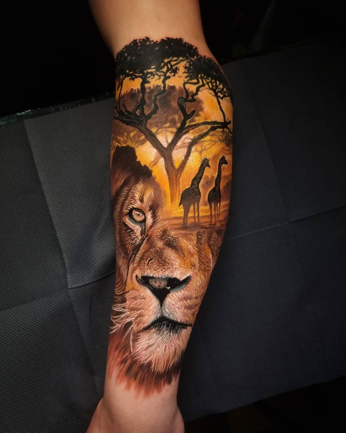 Lion & Giraffes Arm Tattoo