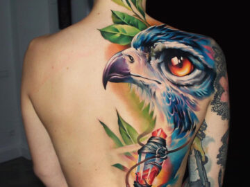 Magical bird back tattoo