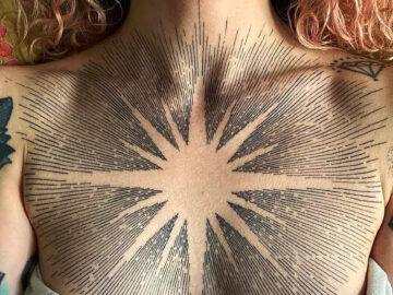 Sun Tattoo on Women's Chest