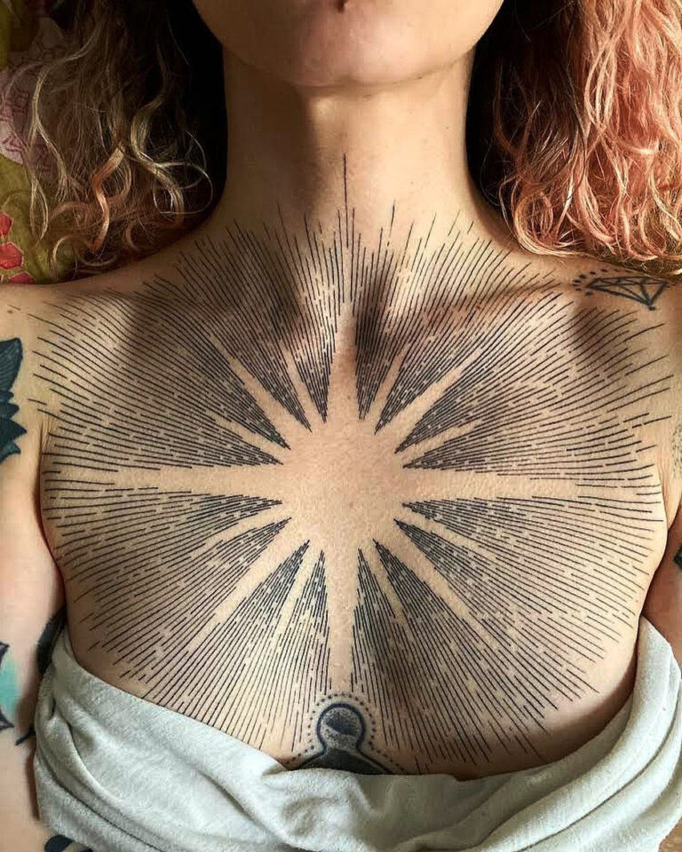 Sun Tattoo on Women's Chest